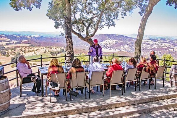 PANDEMIC SEATING Taste with a view at Adelaida Vineyards in a space normally reserved for events, on the hilltop under the canopy of 100-year-old oak trees. - PHOTO COURTESY OF ADELAIDA VINEYARDS AND WINERY