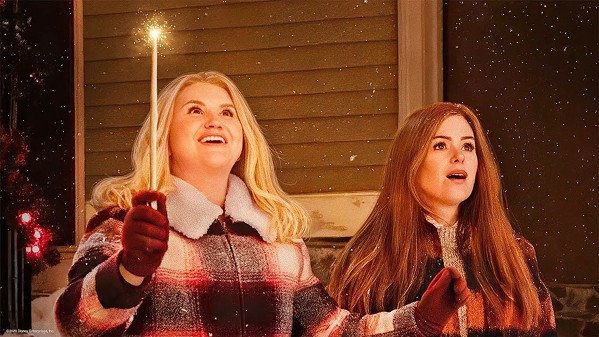 BE CAREFUL WHAT YOU WISH FOR Fairy-godmother-in-training Eleanor Fay Bloomingbottom (Jillian Bell, left) takes on her first assignment, Mackenzie Walsh (Isla Fisher, right), in Disney's Godmothered (2020). - PHOTO COURTESY OF DISNEY