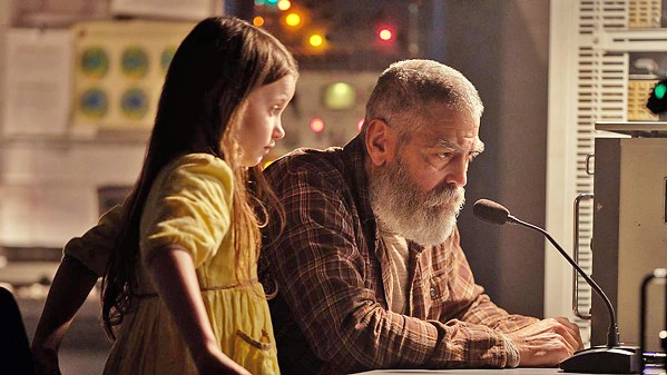 FINAL ACT Terminally ill scientist Dr. Augustine Lofthouse (George Clooney, who also directs), works to contact a spacecraft returning to a doomed Earth while caring for Iris (Caoilinn Springall), a little girl left behind from an evacuation, in The Midnight Sky, streaming on Netflix. - PHOTO COURTESY OF ANONYMOUS CONTENT