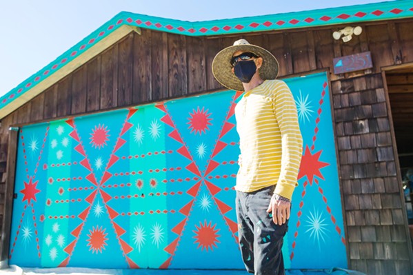 ONE OF A KIND The Edna Valley Design Ranch is already filled with art and custom design, but to spruce up the game room garage door, owner Alaina McBride hired world-famous muralist, Shrine, to free-hand this impromptu design. - PHOTO BY JAYSON MELLOM