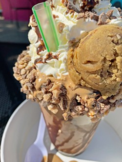 SUGAR HIGH All the Buzz is a classic chocolate shake with a shot of Top Dog Coffee Bar espresso dropped in it, topped with housemade whip, chocolate syrup, toffee bar pieces, and a scoop of mocha toffee chip cookie dough. - PHOTO BY CAMILLIA LANHAM