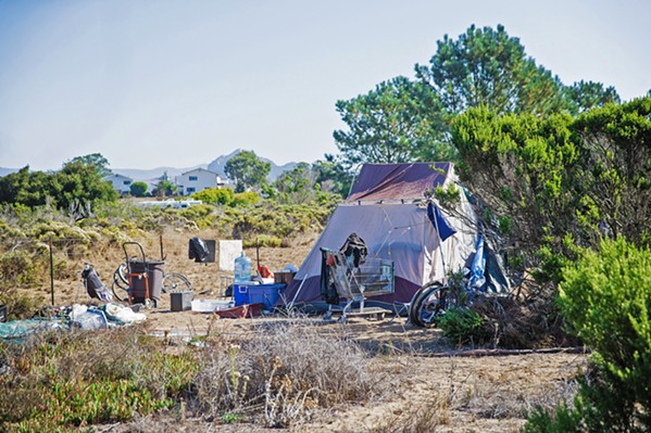OFF THE GRID Those living in homeless camps across SLO County sometimes don't have the documentation needed to get their economic impact payments. - FILE PHOTO BY JAYSON MELLOM