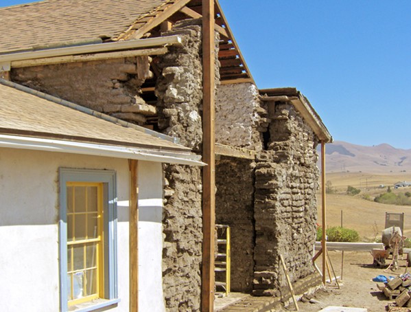 HISTORY RESTORED Here, the Dana Adobe is pictured mid-restoration. The exposed bricks call back to the building's traditional Adobe roots, and the restored parts exhibit some of the Greek revival elements that were woven into the original building. - PHOTO COURTESY OF DANA ADOBE