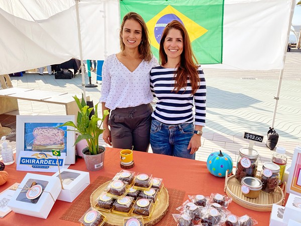 HOOKED ON HONEY Honey Bee SLO co-owners Vanessa Higgins, left, and Carina Lahmeyer sell their homemade Brazilian honey cakes at several Central Coast locations, including Pismo Beach Farmers’ Market at the Pier Promenade on Wednesdays from 4 to 7 p.m. until Oct. 27. - PHOTO BY CHERISH WHYTE