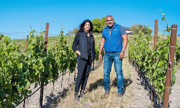 ABUNDANCE Anita Sahi, co-owner of Copia Vineyards in Paso Robles, and her husband, co-owner and winemaker Varinder Sahi, celebrated the first harvest of their own grenache vines this year. - COURTESY PHOTO BY MYKAELA FAULCONER