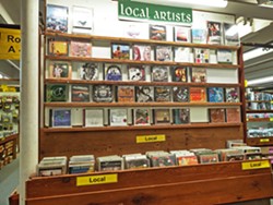 SHOP LOCAL Looking for a locally produced album to give out as a holiday gift? Cheap Thrills' local artist rack has got you covered, This section of the store is dedicated to albums (mostly CDs) from musicians and bands based on the Central Coast. - PHOTOS BY CALEB WISEBLOOD