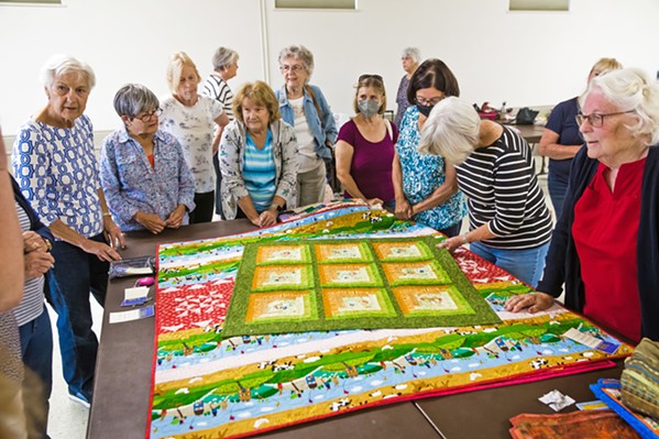 QUALITY TIME Members of the Quilting Angels&mdash;the philanthropic wing of Central Coast Quilters guild&mdash;gather at St. Patrick's Catholic Church in Arroyo Grande to design and stitch quilts for charity. - PHOTO BY JAYSON MELLOM