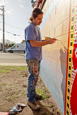 MURALIST Oscar Pearson, who co-founded The Place, has painted murals all over the Central Coast, including at Chacho's Mexican restaurant in Oceano. - PHOTO COURTESY OF THE PLACE ON PCH