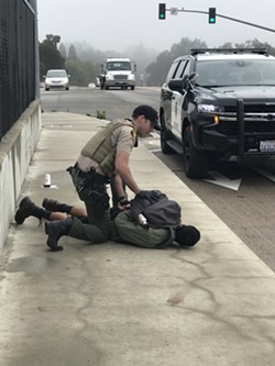 PEACEFUL PROTEST TURNS VIOLENT Officers arrested 46 year old Miguel Angel Olivares of Arroyo Grande after he allegedly pepper-sprayed several protestors in Templeton. - PHOTO COURTESY OF JANICE MUNDEE