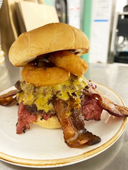 'RIGHTEOUS' The Spicoli&mdash;a nod to Fast Times at Ridgemont High&mdash;will hit Schoolyard's menu shortly. The upcoming burger of the month features two smashed patties, cheddar cheese, bacon, pastrami, onion rings, and hickory smoked barbecue sauce. - PHOTO COURTESY OF SCHOOLYARD BURGERS &amp; BREW