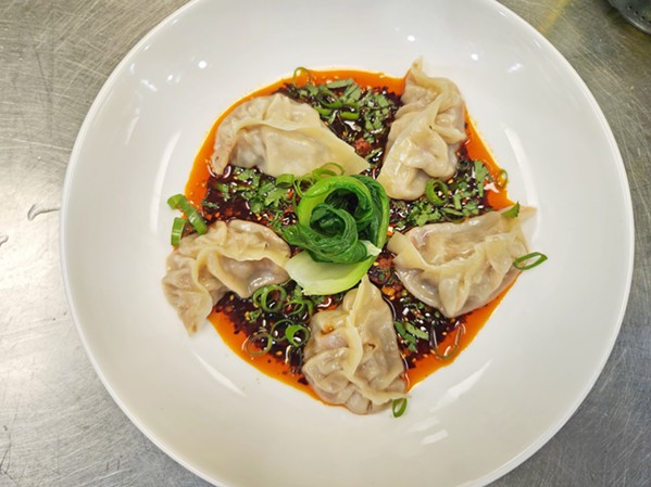 STEAMED DELICACIES Sichuan Duck Dumplings created by Sichuan Kitchen SLO chef Garrett Morris grace the late summer menu at Hotel SLO's Ox + Anchor. Fresh ginger, scallions, and soy-chili vinaigrette complete the dish. - PHOTO COURTESY OF SICHUAN KITCHEN SLO