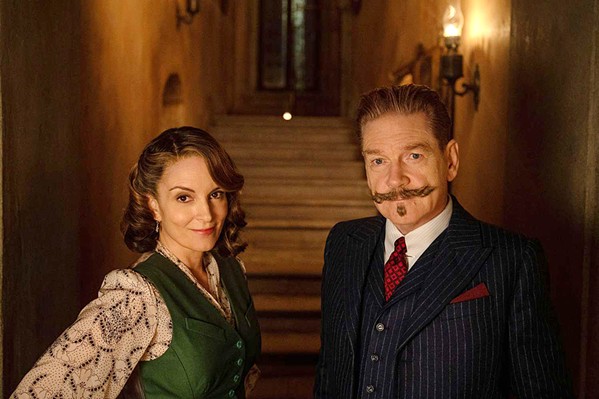 DEBUNK MATES Novelist Ariadne Oliver (Tina Fey) persuades retired detective Hercule Poirot (Kenneth Branagh) to join her at a s&eacute;ance in the hopes of debunking it, in A Haunting in Venice, screening in local theaters. - COURTESY PHOTO BY ROB YOUNGSON/20TH CENTURY STUDIOS