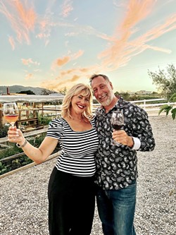 LIVIN' THE DREAM Kristy and Evan Bishop, owners of Reves de Moutons farm and Black Market Cheese Co., enjoy sunset on their Paso Robles property. - COURTESY PHOTO BY ROSA LIMA