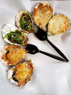 ON FIRE Tuck into broiled oysters at Mother Shuckers that come with toppings (from left to right) like a Cajun blend, poke sauce and seaweed salad, and lemon garlic butter with panko crumbs. - COURTESY PHOTOS BY KISA MAXWELL