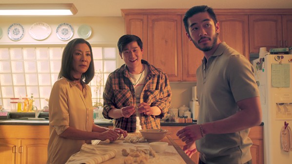 FUN WITH THE SUNS Michelle Yeoh stars as Eileen "Mama" Sun, the matriarch of a Chinese Triad gang, whose two sons, Bruce &#10;(Sam Song Li, center), and Charles (Justin Chien), couldn't be more different, in &#10;the bingeable new &#10;Netflix series, The Brothers Sun. - PHOTO COURTESY OF NETFLIX