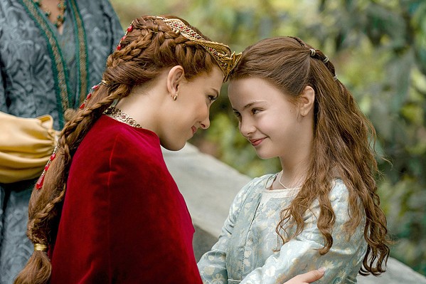 SISTERLY LOVE Elodie (Millie Bobby Brown, left) and her sister, Floria (Brooke Carter), share a moment on Elodie's wedding day, both unaware that Elodie must soon battle a dragon, in Damsel, streaming on Netflix. - COURTESY PHOTO BY JOHN WILSON/NETFLIX