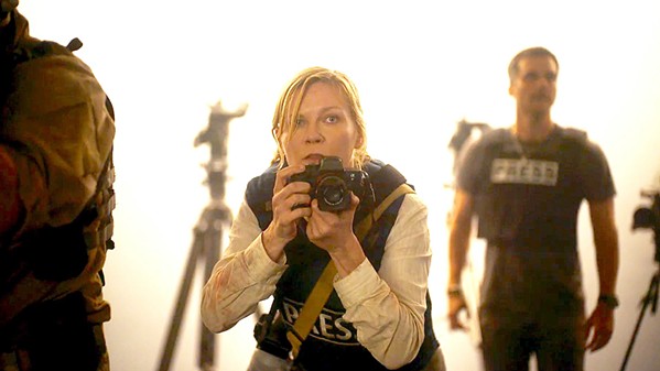 WAR-CORE DESPONDENT Kirsten Dunst stars as Lee Smith, a hardened journalist covering a new American civil war, who's racing to Washington, D.C., as the seceding states' militias invade, in Civil War, screening in local theaters. - PHOTO COURTESY OF A24