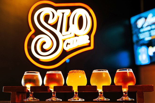 CRISP BEVERAGE SLO Cider takes its adult beverage inspiration from the apple. The Best Cidery in SLO County can whip you up a sampler just like this, which contains its dry, ros&eacute;, mango, pineapple, and blood orange ciders (left to right). - PHOTO BY JAYSON MELLOM