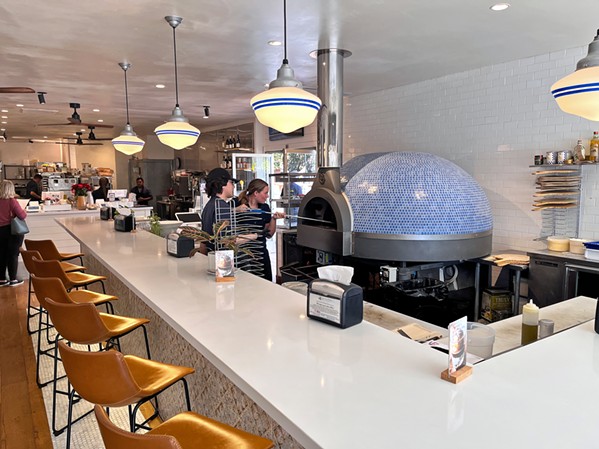 ITALIAN IMPORT With a wood-fired pizza oven from Italy as the interior showstopper, the rejuvenated Branch Street Deli recently underwent a complete renovation for the first time since 1997. - PHOTOS COURTESY OF BRANCH STREET DELI