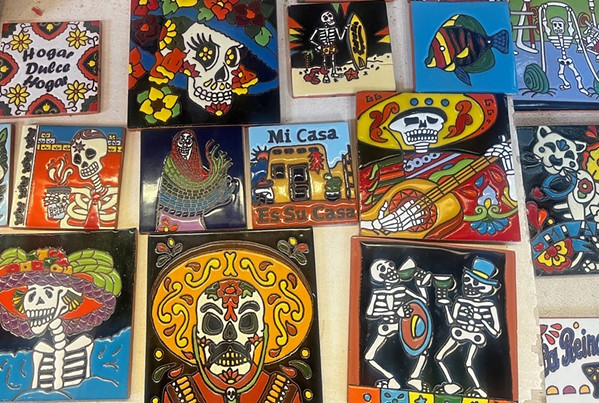 HONOR THE DEAD Dozens of Mexican-style mosaics welcome visitors to Harmony Pottery Works. They range in designs and colors. - PHOTO BY SAMANTHA HERRERA