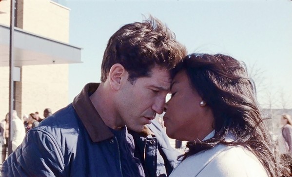 MISCENGENATION NATION With the support of her husband, Brett (Jon Bernthal), author Isabel Wilkerson (Aunjanue Ellis-Taylor) writes her groundbreaking nonfiction book, Caste: The Origins of Our Discontents, in the biopic Origins, streaming on Hulu. - COURTESY PHOTO BY ATSUSHI NISHIJIMA/NEON