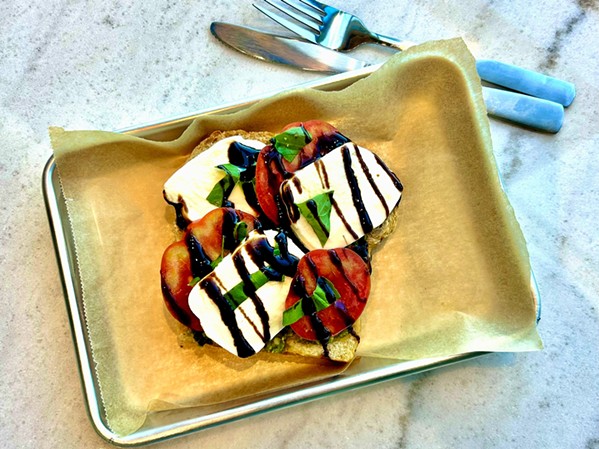 THE PERFECT TOAST Farmhouse proprietor Kelli Salter suggests pairing a ros&eacute; from Paso Robles' Hawks Hills Ranch with her caprese toast. "The bright acid will cut through the mozzarella and hold up to the tomato," she says. - PHOTO COURTESY OF FARMHOUSE CORNER MARKET &amp; WINE LOUNGE