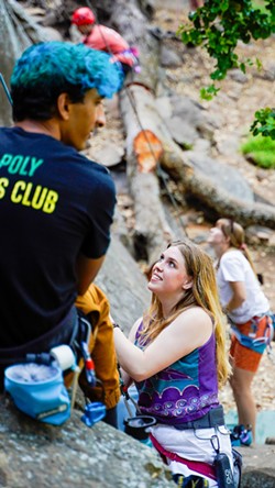 Queer Ascents Fundraiser and Event Coordinator Leah Smith belays a fellow climber during a meet-up at Bishop Peak. - PHOTO COURTESY OF JESSE CABACUNGAN