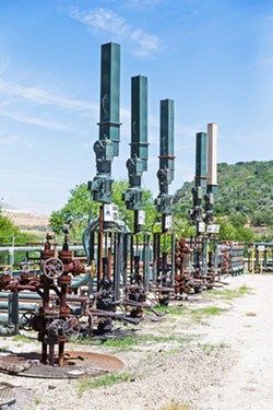 RESUMING OPERATIONS Sentinel Peak Resources, with operations in Lompoc and Price Canyon (pictured), proposed to truck oil from the Lompoc Oil Field through parts of SLO County to Coalinga in order to resume operations that halted due to Phillips 66 closing down its Nipomo refinery and pipelines. - FILE PHOTO BY JAYSON MELLOM