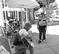 READING, AND SINGING, IN PUBLIC :  James Darden is apprehended by security during his Reading in Public performance on Aug. 1. - PHOTO COURTESY OF NOTHING HAPPENED HERE