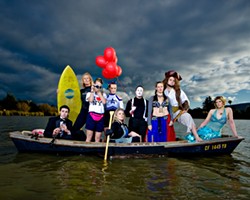 ALL IN THE SAME BOAT :  (l-r) Daniel Salas (musician), Shelley Malcolm (surfer), Sarah Worrell (tourist), Courtney Rucker (cheerleader), Christy Heron (&lsquo;50s housewife) Amy Asman (mime), Adaire Hahn (belly dancer), Ryan Miller (pirate), and Heather Weltner (mermaid). Art director: Ashley Schwellenbach. Hair and makeup by Shelby Hood. Boat (the Mudhen) courtesy of Glen Starkey. - PHOTO BY STEVE E. MILLER