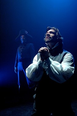 SHADES OF GRAY :  Jean Valjean (Sam Zeller) pursues redemption while shadowed by the immoveable Javert (Erik Stein). - PHOTO BY LUIS ESCOBAR/ REFLECTIONS PHOTOGRAPHY STUDIO