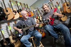 THE DAY THE MUSIC THRIVED :  Floor Manager Andy Morris (left) and owner Dan Ernst have relocated Grand Central Music Conservatory to a smaller but more functional space. - PHOTO BY STEVE E. MILLER