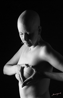 CANCER TAKES THE BODY BUT NOT THE SOUL :  Breast cancer survivor Leslie Neely shows off her scar, which could have been a lot worse had she not had a mammogram that diagnosed her cancer early, in photographer Jimmy de&rsquo;s image entitled &ldquo;Battle Scars.&rdquo; - PHOTO BY JIMMY DE