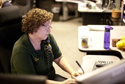 FIRST LINE :  Dispatchers like Jan Dishen say they&rsquo;re trained to take control of 911 calls because, as she says, &ldquo;it&rsquo;s the most traumatic thing that&rsquo;s ever happened in their life, and we&rsquo;re the first person they talk to.&rdquo; - PHOTO BY STEVE E. MILLER