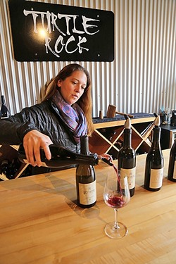 TURTLE ROCK:  Claudia Burns of Turtle Rock Wines pours a splash of small-batch Zinfandel at Paso Underground, an eclectic wine hub hidden in downtown Paso Robles. The family-owned winery creates artisanal wines from fruit sourced from the Willow Creek District. - PHOTO BY DYLAN HONEA-BAUMANN