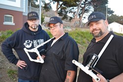 THE CREW:  CCPI founder Mitch Flores (left), senior investigator Micah Watkins (center) and tech coordinator Rob Burr (right) prepare equipment for their paranormal investigation. - PHOTO BY RHYS HEYDEN