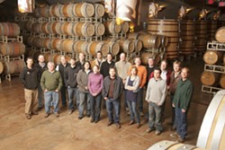COMMON CAUSE :  The Rhone Rangers (pictured here in the Robert Hall Winery caves) come together to promote American Rhone varieties. - PHOTO BY STEVE E. MILLER