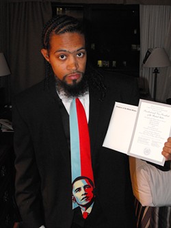 SANTA MARIA TO WASHINGTON, D.C.:  Marcus King is vice-president of Allan Hancock College's Associated Student Body Government. Here, he's holding the inaugural tickets he received from U.S. Rep. Lois Capps'office. - PHOTO BY JEFF HAMSHER
