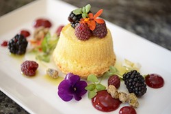 BERRY DELICIOUS:  Desserts at Willow include this olive oil cake with goat cheese coulis, raspberry gel, local fresh berries, braised pistachio, micro herbs, and edible flowers. - PHOTO BY STEVE E. MILLER