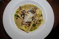 FOOD!:  Ember&rsquo;s housemade green garlic ravioli with wild and king trumpet mushrooms, Rutiz Farms mint, and grana padano are irresistibly delicious. - PHOTO BY DAN HARDESTY