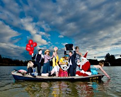 ALL IN THE SAME BOAT :  (DOUBLE TAKE) (l-r) Christy Heron (&lsquo;50s housewife), Amy Asman (mime), Chloe Rucker (farmer), Ellie Cattaneo (soccer player), Kristina Bennett (hippie), Brent Staple (businessman), Dora Mountain (beauty queen), Ed Connolly (Santa), and Heather Weltner (mermaid). Art director: Ashley Schwellenbach. Hair and makeup by Shelby Hood. Boat (the Mudhen) courtesy of Glen Starkey. - PHOTO BY STEVE E. MILLER