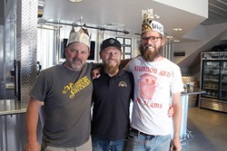 WINEMAKERS GET FROTHY:  From left to right, winemaker Sherman Thacher of Thacher Winery, Firestone Walker Brewing Co. Brewmaster Matt Brynildson, and Daniel Callan of Thacher Winery. Thacher and Callan created the winning blend that became the basis for Firestone&rsquo;s XIX Anniversary Ale (hence, the crowns). - PHOTO COURTESY OF FIRESTONE WALKER BREWING CO.