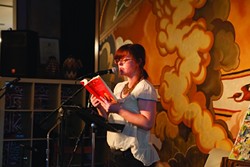 ALMOST POETRY:  New Times managing editor Ashley Schwellenbach read a passage from her debut young adult novel Scourge of the Righteous Haddock. - PHOTO BY COLIN RIGLEY