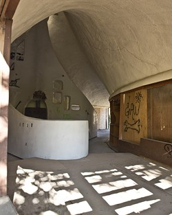 THE SHELL OF A HOUSE:  Third-year history major Ryan Kadlec analyzes Cal Poly's &ldquo;Shell House&rdquo;&mdash;vandalized by some, treasured by others&mdash;as an example of the changing reactions to public art. - PHOTO BY STEVE E. MILLER