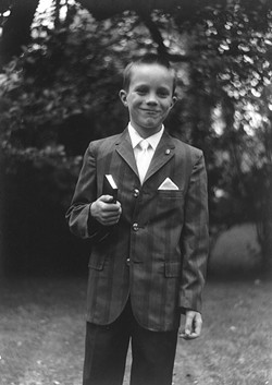 THEN:  John C. Hampsey, seen here as a 7-year-old after his first communion, writes of boyhood events between age 7 and 14. - PHOTO COURTESY OF JOHN C. HAMPSEY