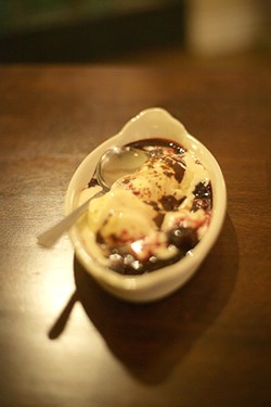 COURSE SIX :  The evening concluded with ice cream topped with dark cherries and chocolate sauce. - PHOTO BY GLEN STARKEY
