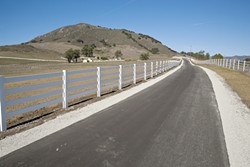 HAPPY TRAIL:  The Madonna Inn bicycle path, set to open to the public in winter 2011, will run along the Madonna Inn property and connect downtown San Luis Obispo to the Madonna Road shopping center and Laguna Middle School. - PHOTO BY STEVE E. MILLER