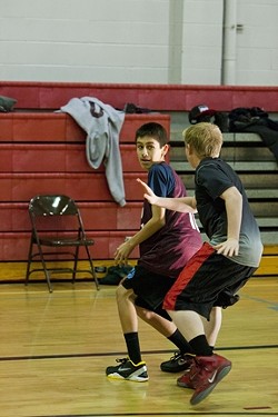FULL PRESS :  Eighth grader Arturo Resendez faces a defender during an early morning scrimmage over winter break.