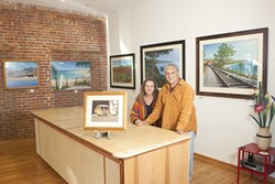 HOME AGAIN :  John Ramos&mdash;pictured here in his new gallery with his wife, Donna&mdash;returned to the area after living for four years in Mexico. - PHOTO BY STEVE E. MILLER