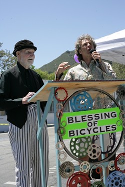 HOLY ROLLERS!:  Robert Norton (left) took care of the bike blessing, and Mark &ldquo;Gizmo&rdquo; Grayson acted as Master of Ceremonies at the inaugural SLO Blessing of the Bicycles on May 18 at Salon 544, at 544 Higuera St. - PHOTO BY GLEN STARKEY